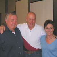 Glenn Jackson and Stormy Martin pose for a picture with Story Musgrave